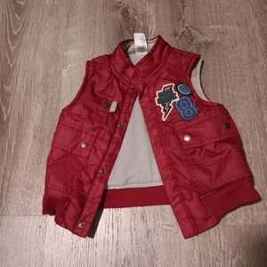 Size 2T winter vest for a toddler. Patches on front